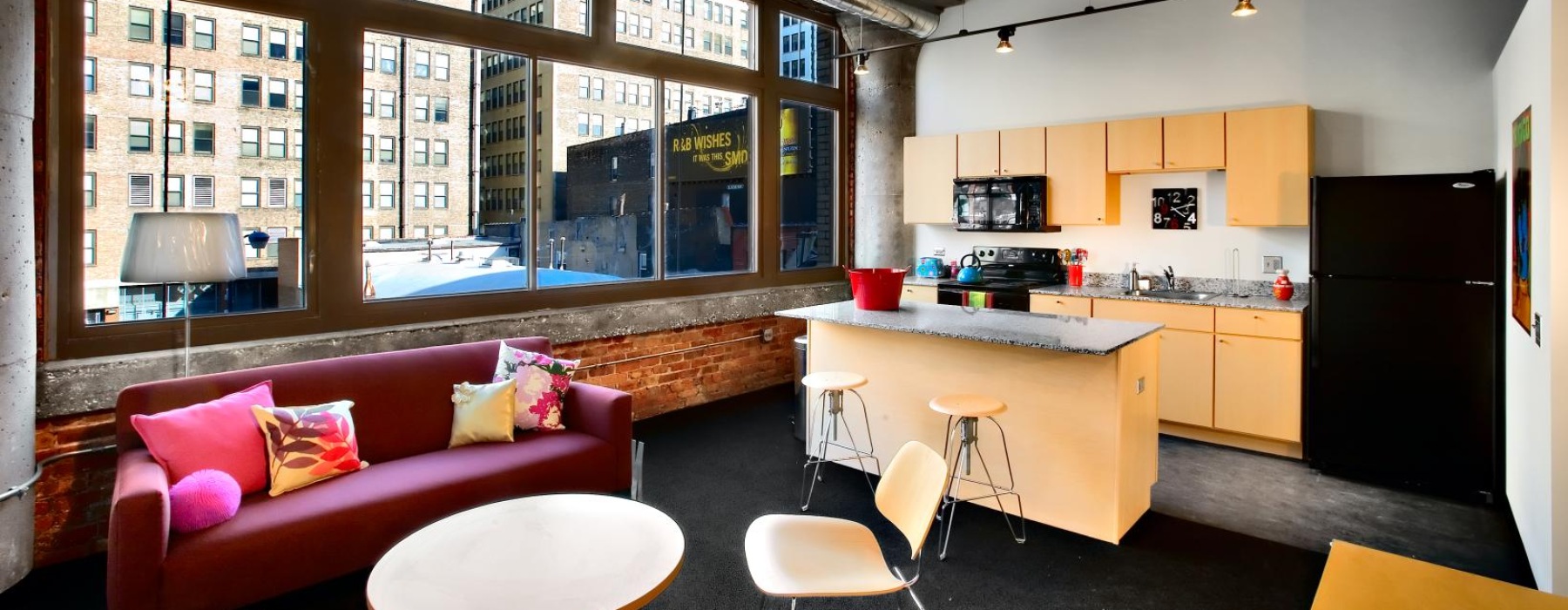 a living room with a red couch