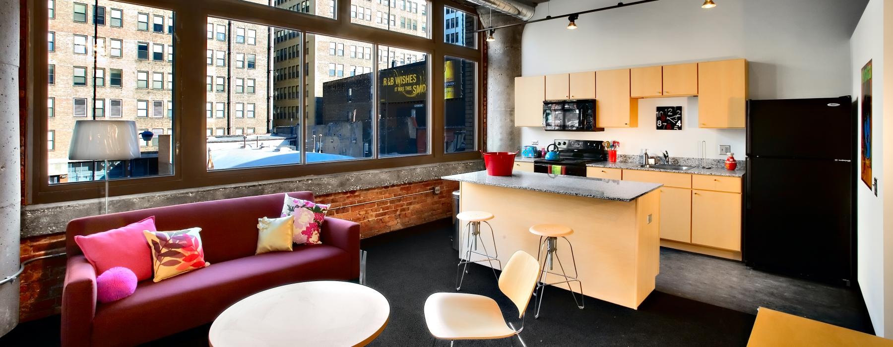 a living room with a red couch